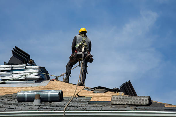 Professional Roof Replacement technician working in Huston, ID